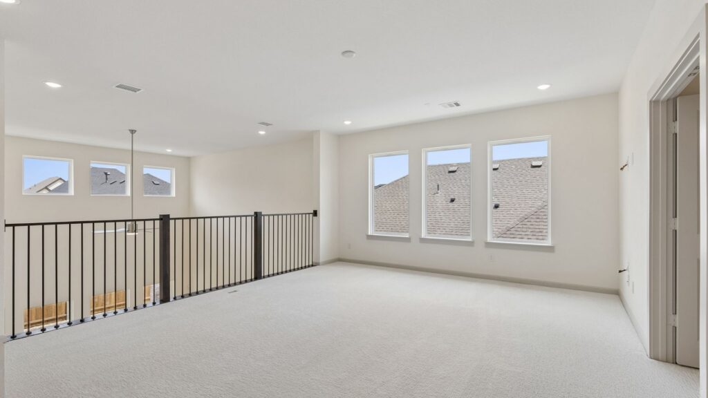 Gameroom in 15734 Split Bark Lane at Hazelwood 55' Series in Frisco, TX.